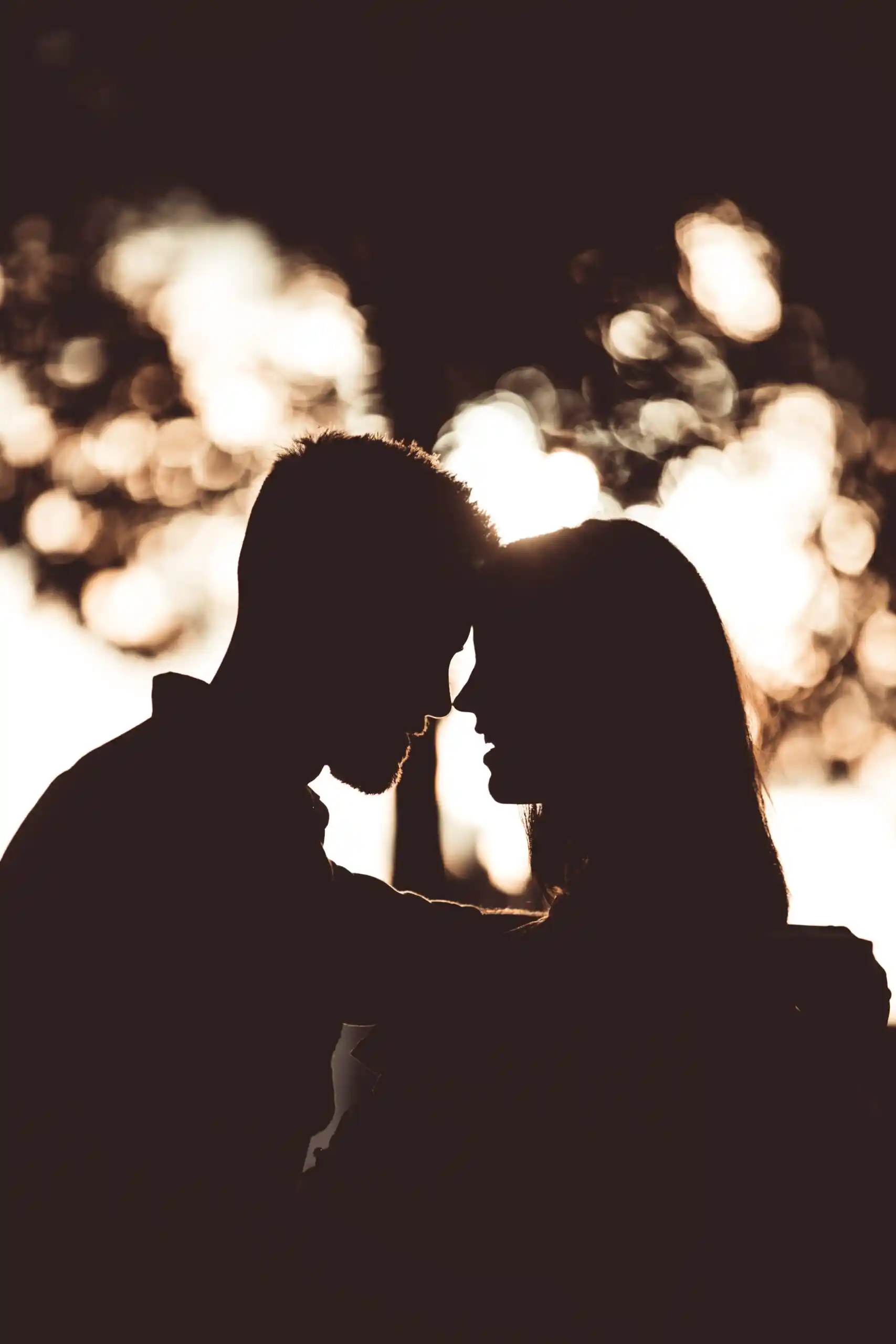 silhouette of man and woman embracing