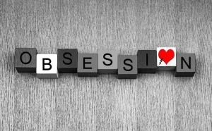 text blocks that say obsession with heart on the O