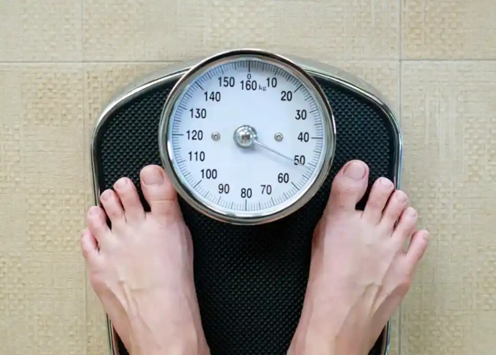 feet standing on a scale