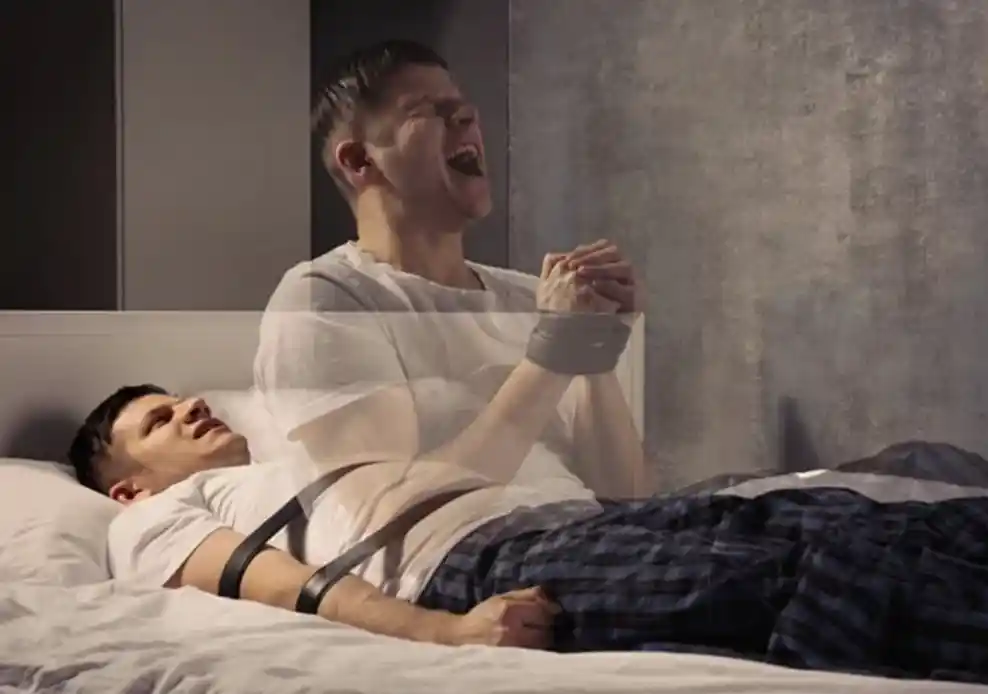 man struggling with sleep paralysis