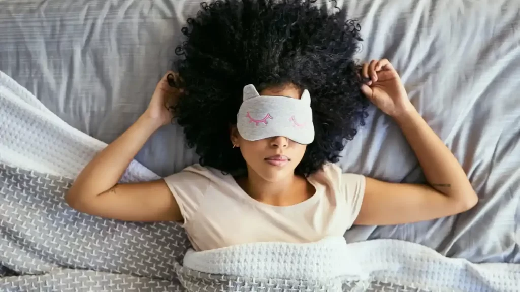 woman sleeping comfortably in bed