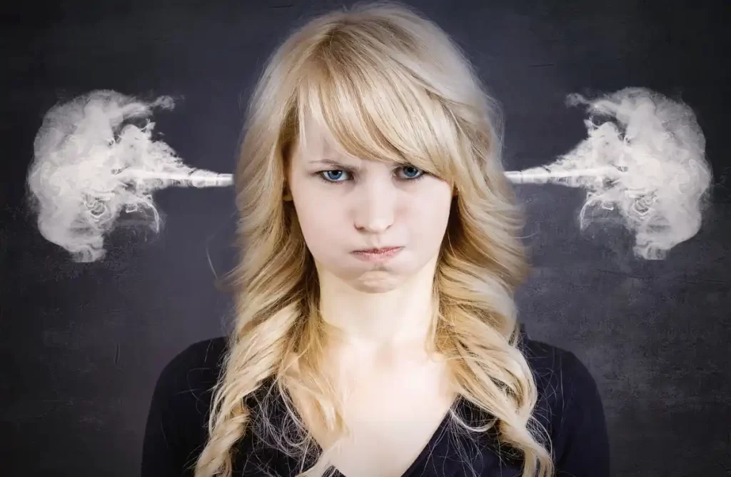 woman with angry face and steam coming out of her ears