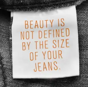text saying beauty is not defined by the size of your jeans