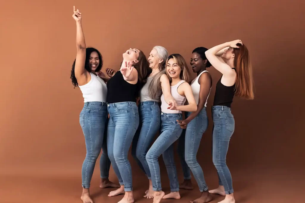 group of women of different sizes in a row having fun