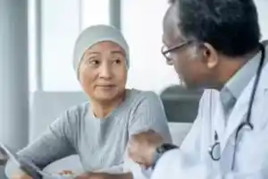 doctor talking to woman with ovarian cancer