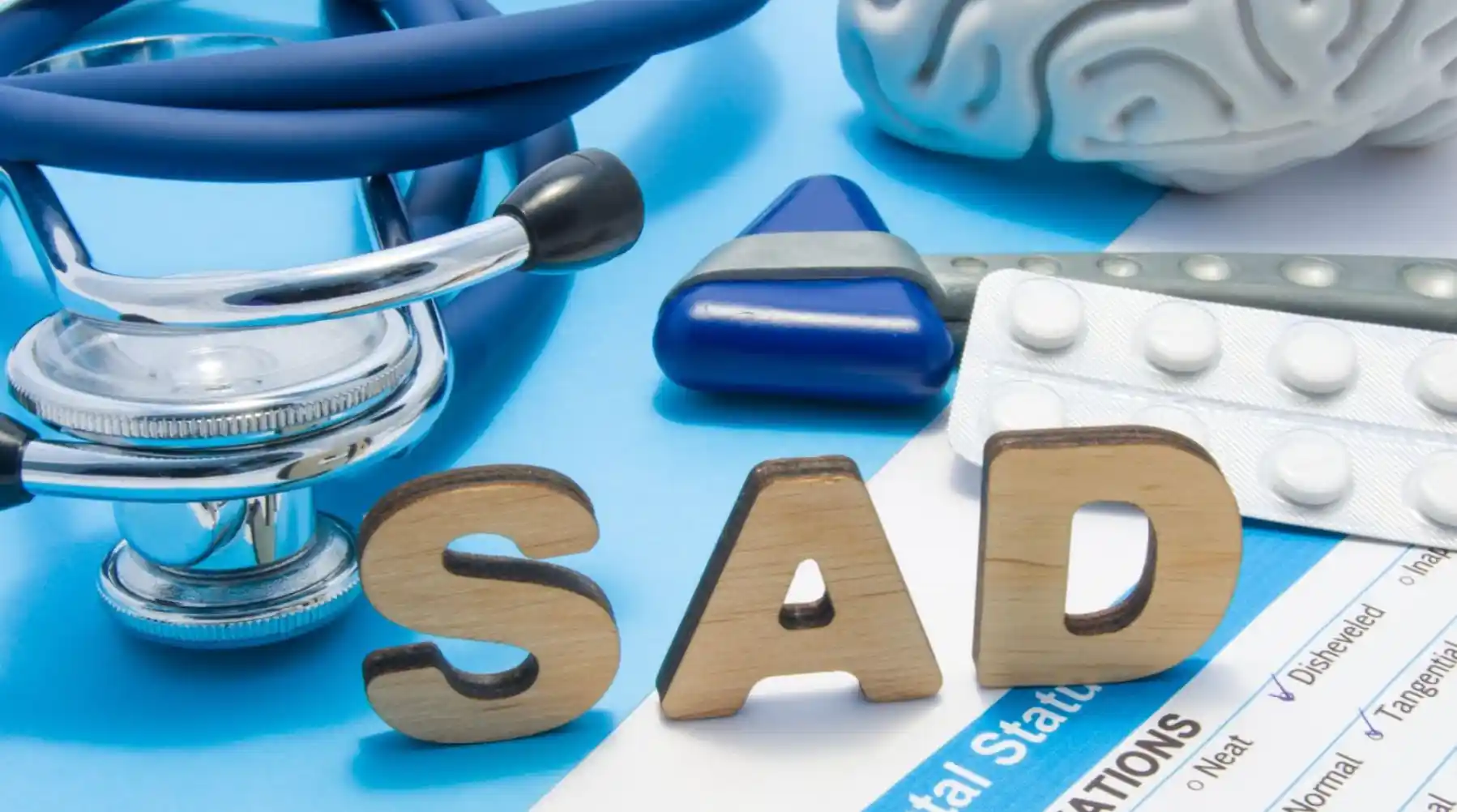 medical equipment on a table with text saying sad